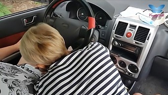 A Woman Performs Oral Sex On A Man In A Car